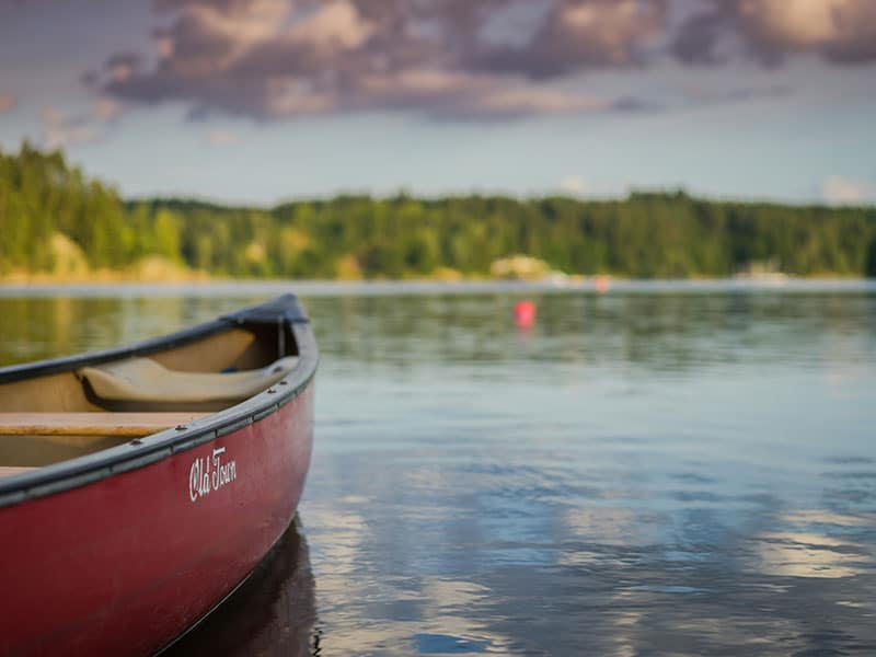 A red canoe on a lake